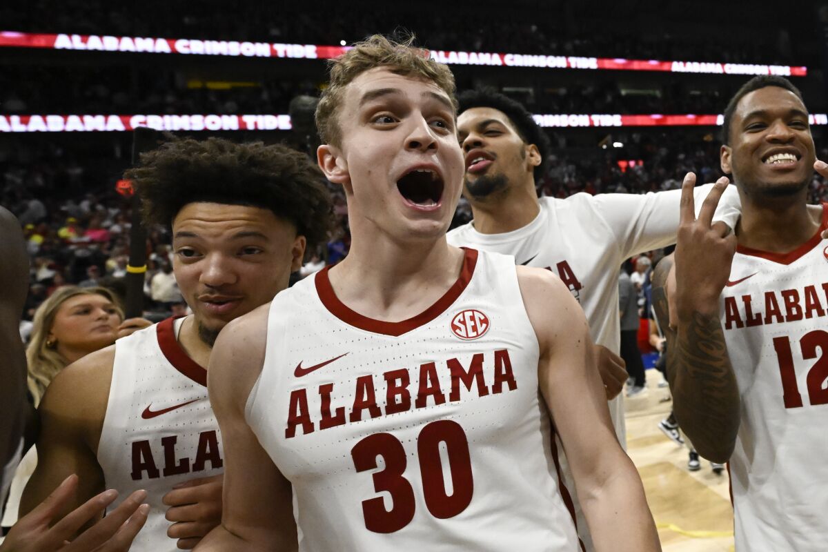Alabama guard Adam Cottrell celebrates in the finals of the Southeastern Conference tournament.