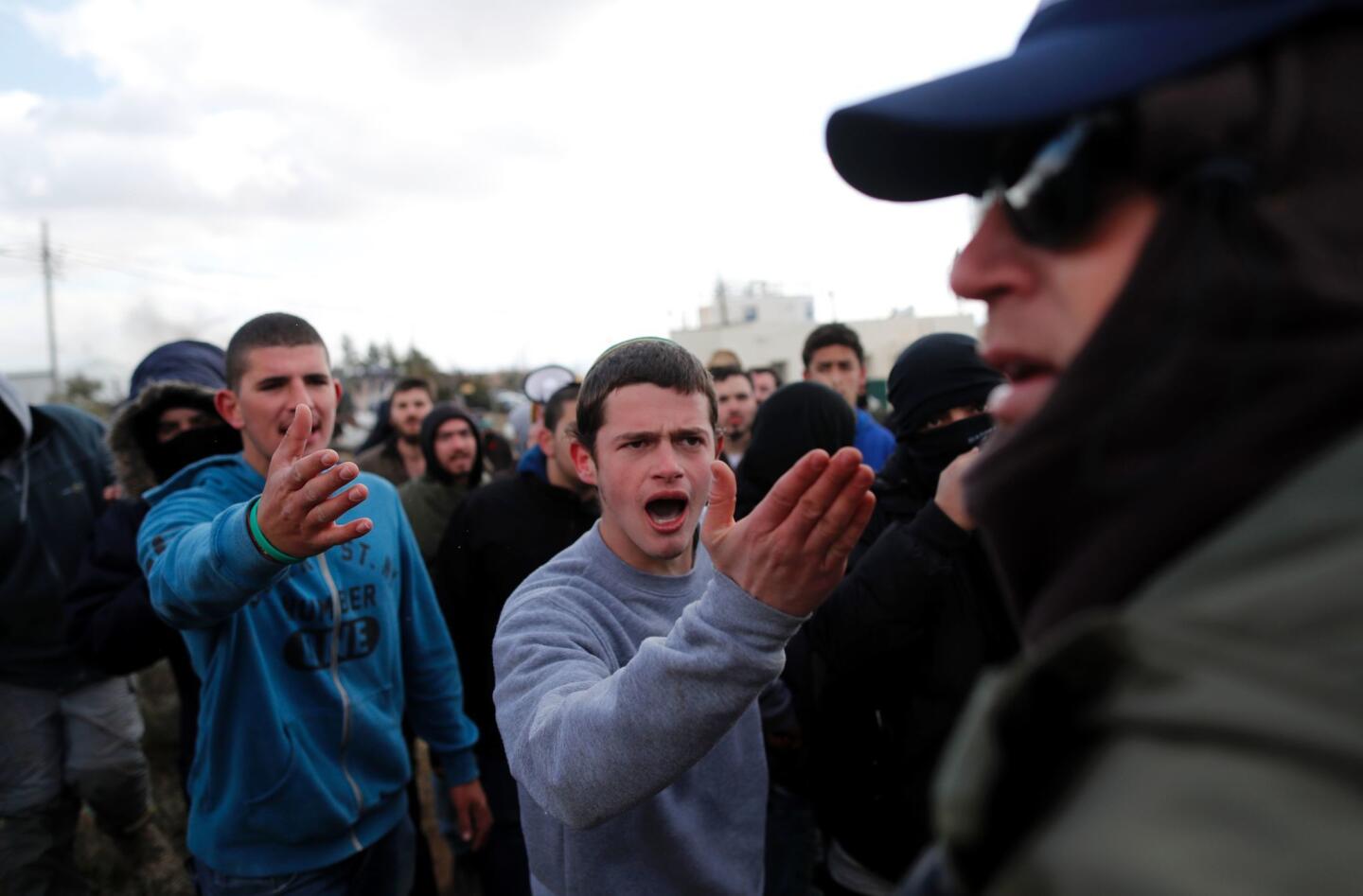 Israeli forces evacuate settlers from West Bank outpost of Amona