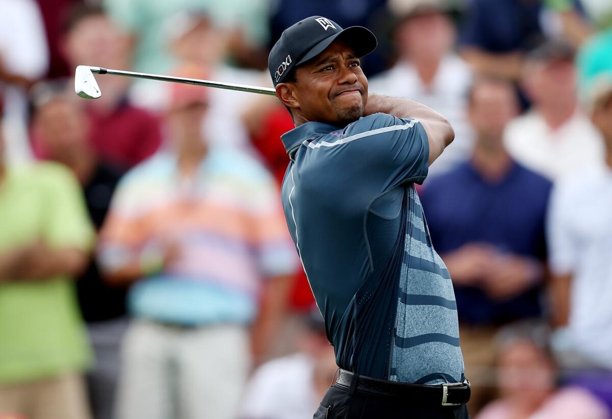 Tiger Woods will miss the NB3 Challenge charity event this week because of back spasms.