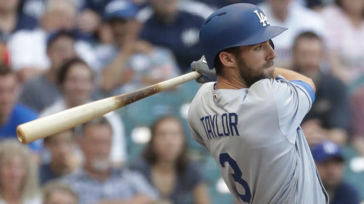 Dodgers' Chris Taylor hits a grand slam during the ninth inning against Milwaukee on June 3.