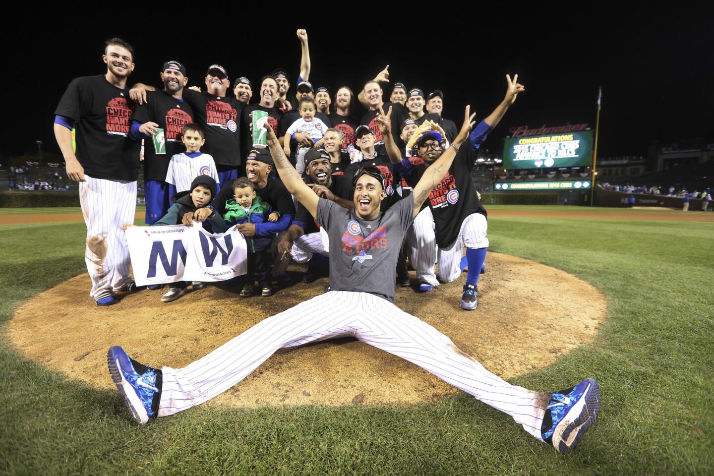 The Cubs pose on the mound after their Game 4 win.