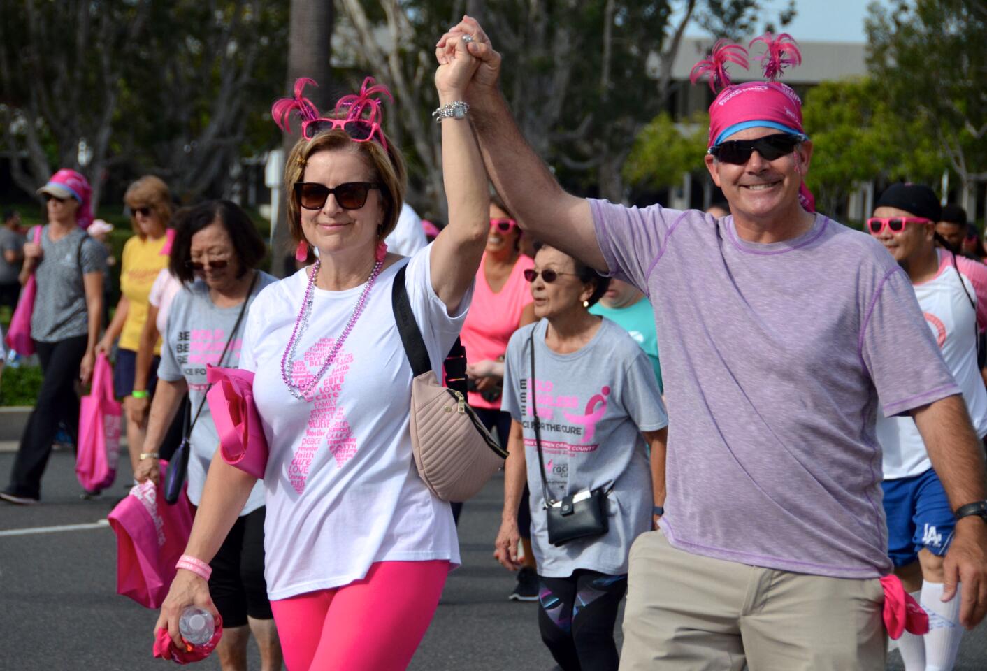 Claudia and Mark Ross walk Sunday in Newport Beach during the More than Pink 5K to benefit Susan G. Komen Orange County.