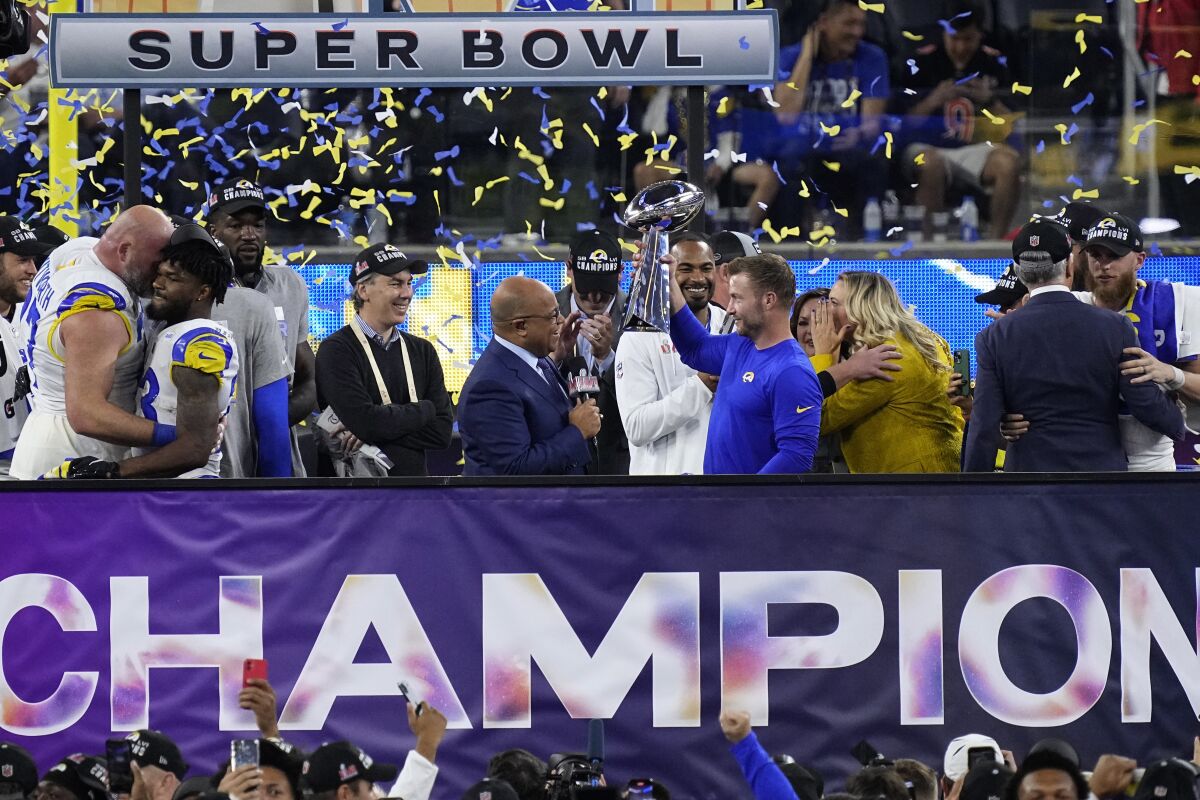 Los Angeles Rams head coach Sean McVay holds the Lombardi Trophy after the NFL Super Bowl 56 football game Sunday, Feb. 13, 2022, in Inglewood, Calif. The Rams defeated the Cincinnati Bengals 23-20. (AP Photo/Ted S. Warren)