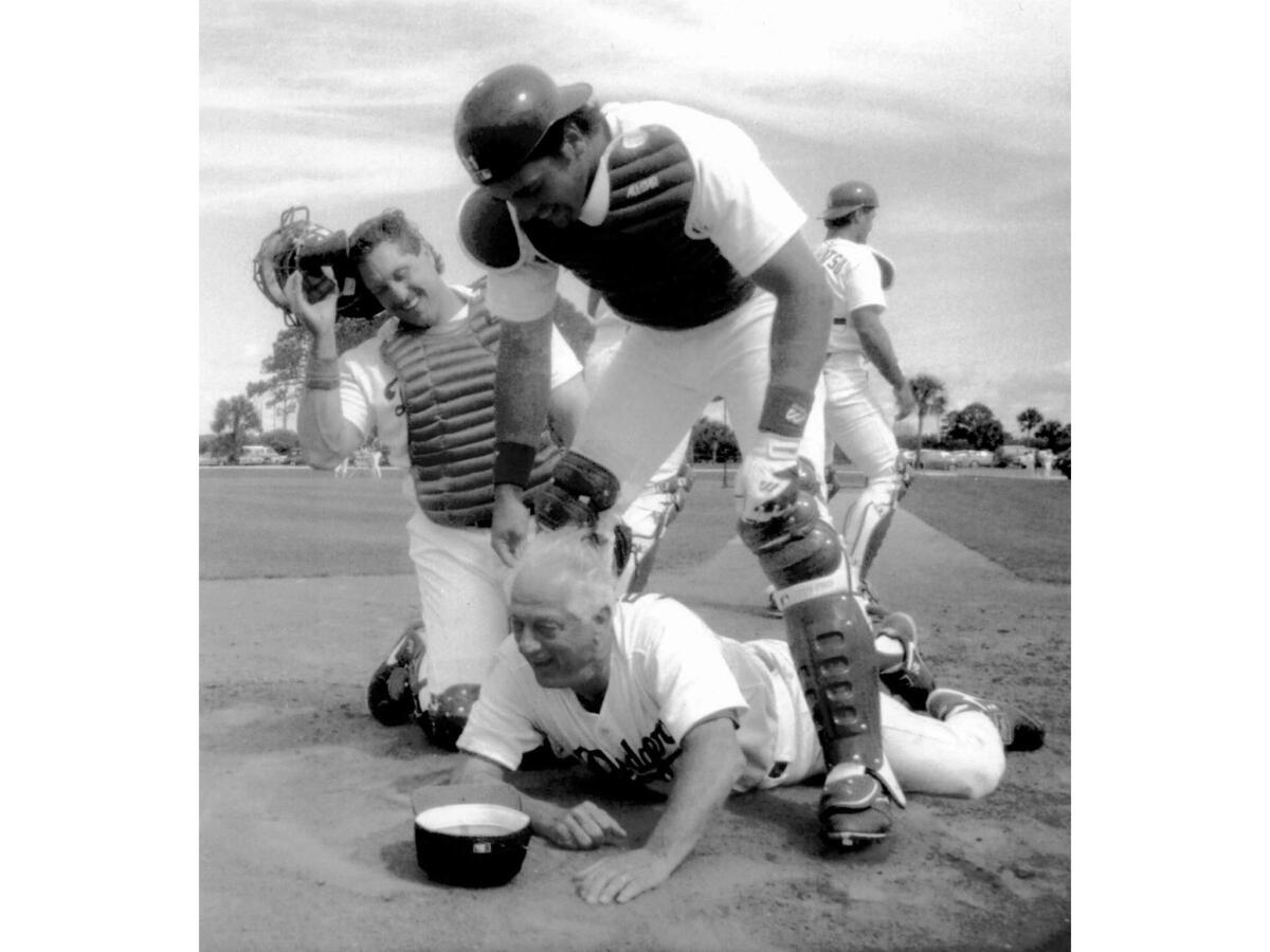 March 31, 1993: Tommy Lasorda demonstrates what he wants to see during the upcoming season — Dodgers crossing home plate.