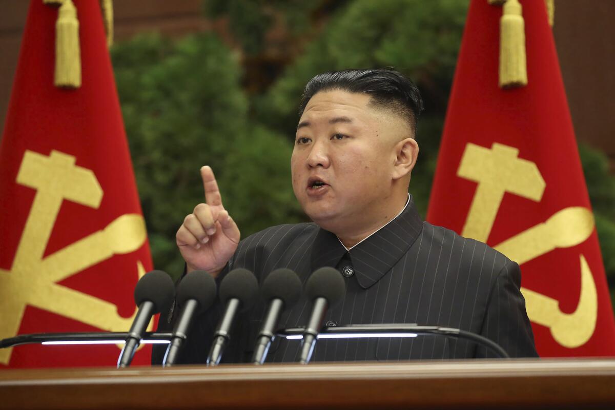 North Korean leader Kim Jong Un raises a finger while speaking