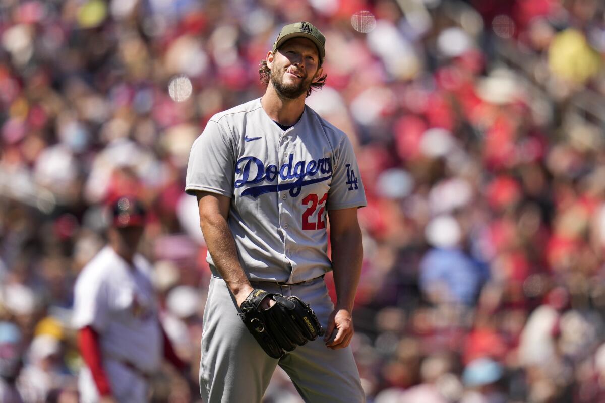 Dodgers starting pitcher Clayton Kershaw reacts after walking the Cardinals' Lars Nootbaar.