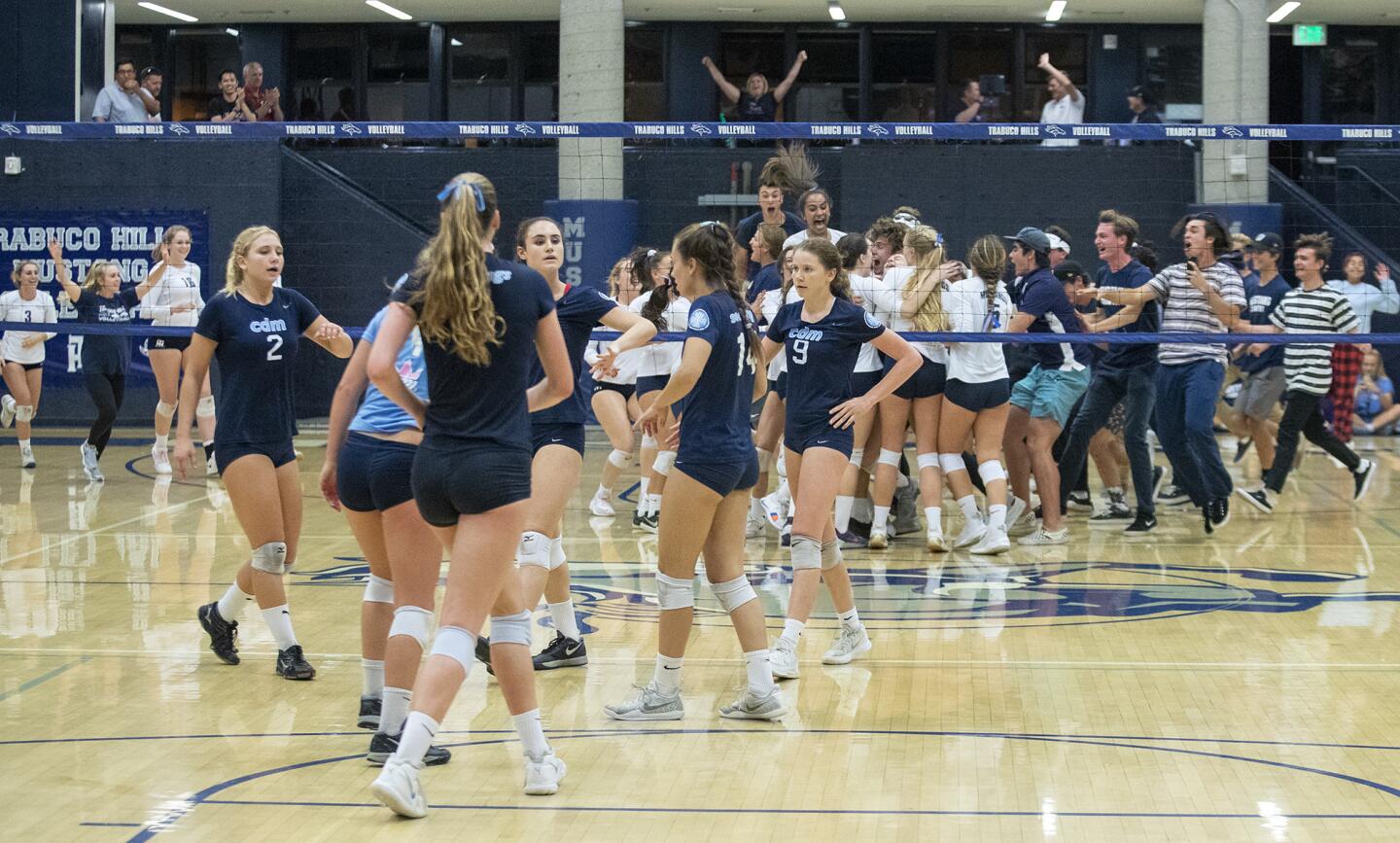 Trabuco Hills celebrates after beating Corona del Mar in a game five tie breaker during a quarterfinals game of the CIF Southern Section Division 2 playoffs on Wednesday, October 24.