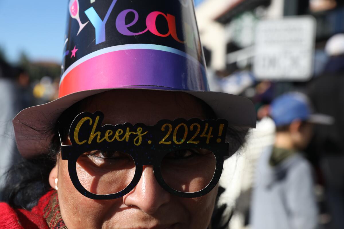 A reveler shows off 2024 glasses in Pasadena