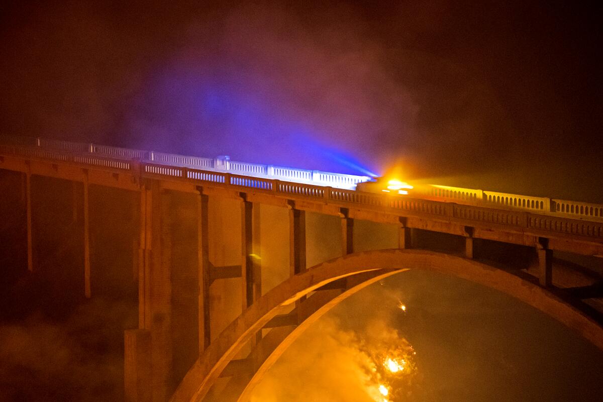 The Colorado Fire burns under Rocky Creek Bridge on Saturday.
