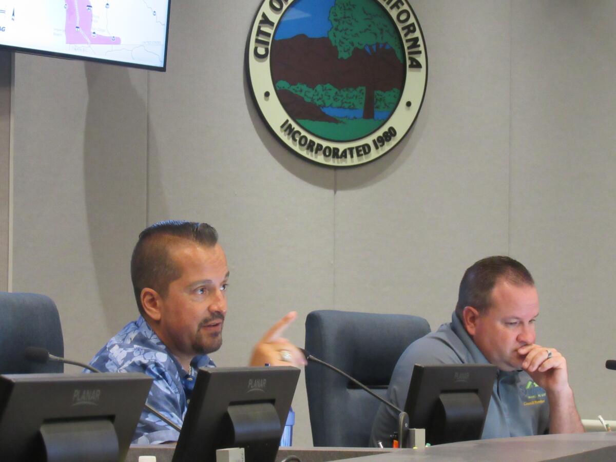 Santee City Councilman Rob McNelis (left) tells SANDAG and Caltrans representatives that the city wants freeway improvements.