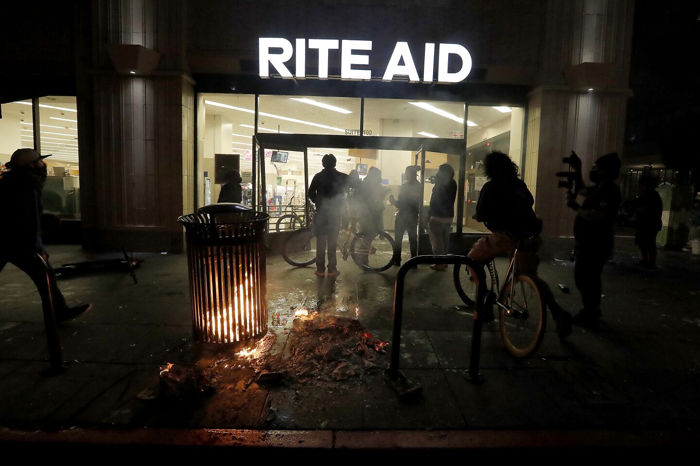 People break into a Rite Aid store in downtown Los Angeles