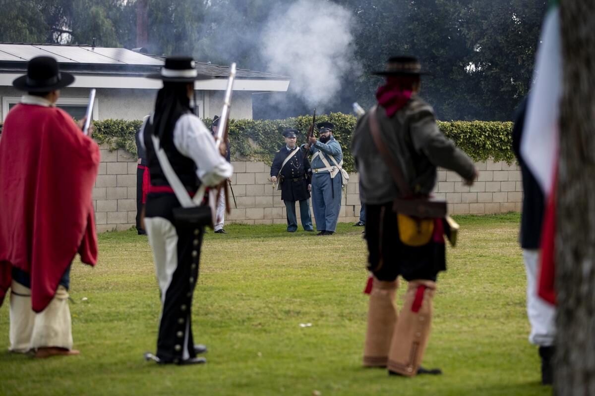 American infantry soldiers confront Mexican soldiers during a reenactment of the Battle of Rio San San Gabriel in Montebello.