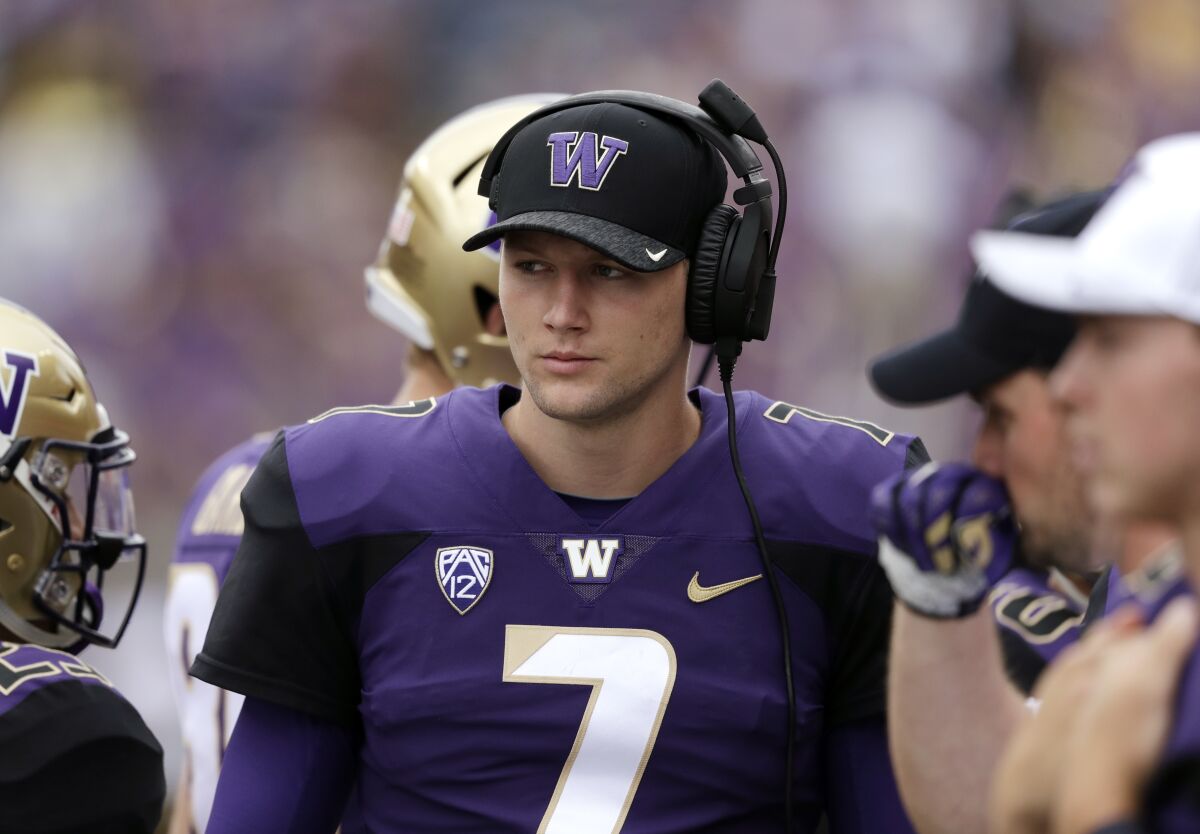 Quarterback Colson Yankoff when he was at Washington in 2018, watching from the sidelines.