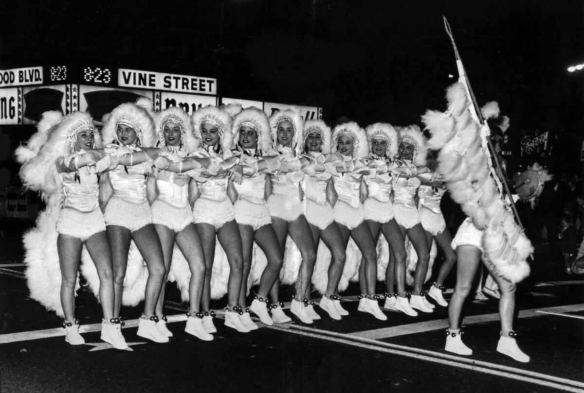 Nov. 25, 1964: The Barbarettes, a precision drill team from Santa Barbara, marches at the intersection of Hollywood and Vine in the 33rd Santa Claus Lane Parade.