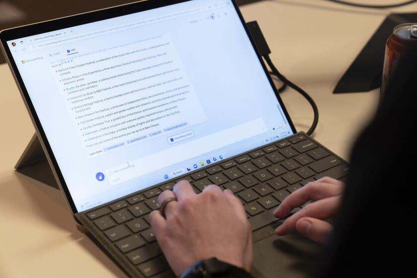 Microsoft employee Alex Buscher demonstrates a search feature integration of Microsoft Bing search engine and Edge browser with OpenAI on Tuesday, Feb. 7, 2023, in Redmond. (AP Photo/Stephen Brashear)