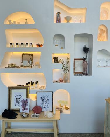 Perfume, gifts on shelves in shop 