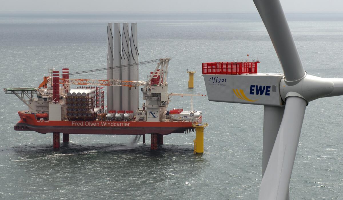 The jack-up installation vessel "Bold Tern" stands near the Riffgat offshore wind farm in the North Sea near Borkum, Germany. The Riffgat facility, which includes 30 turbines, is expected to provide power to 120,000 households.