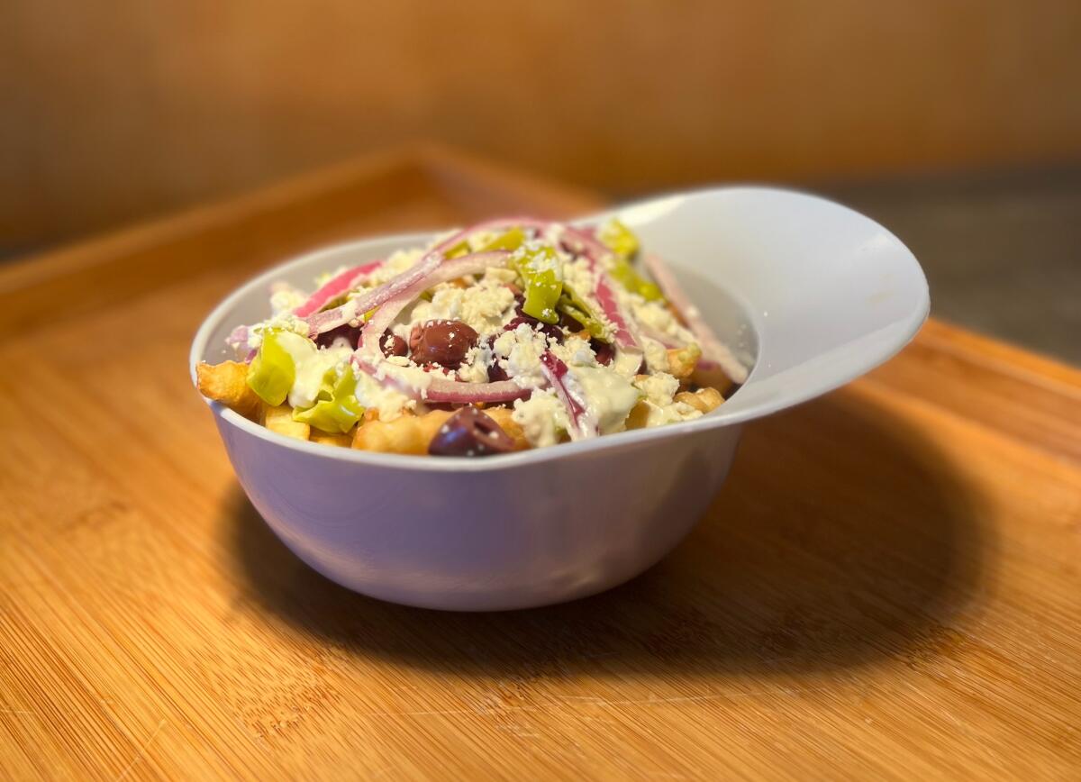 The Greek Loaded Fries is shown.