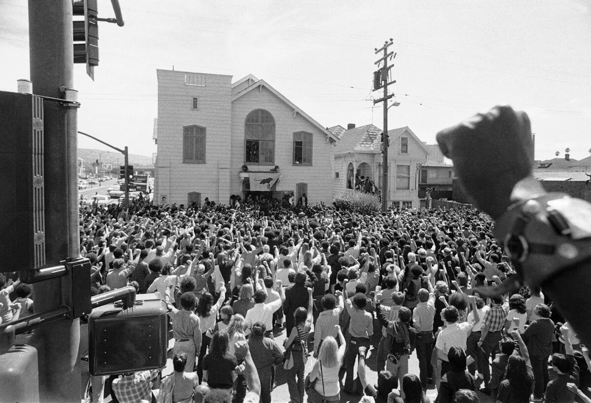 About 1,500 mourners give the Black Panther salute as the body of slain Soledad Brother George Jackson was carried from St. Augustine's Episcopal Church in Oakland, Calif. on Saturday, Aug. 28, 1971. They shouted "Power to the people!" Jackson was shot to death by guards last Saturday apparently when he attempted to escape from San Quentin Prison.