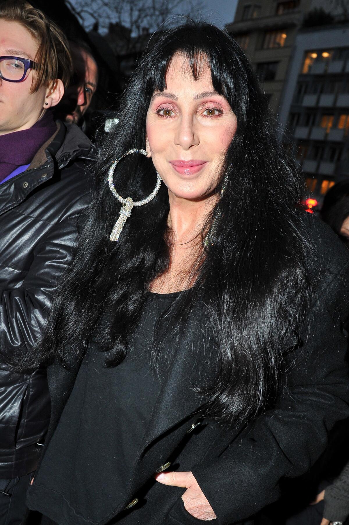 Singer/actress Cher leaves British fashion designer Gareth Pugh's fall-winter fashion presentation Wednesday in Paris.