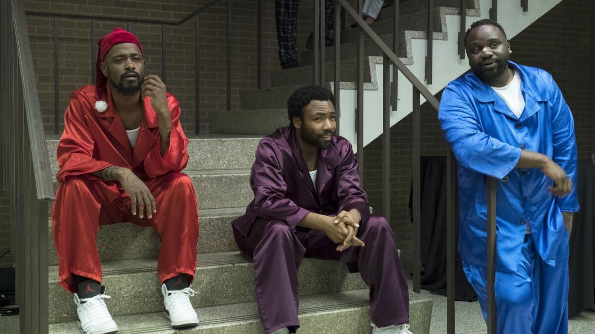 Lakeith Stanfield from left, Donald Glover and Brian Tyree Henry in a scene from the comedy series "Atlanta."