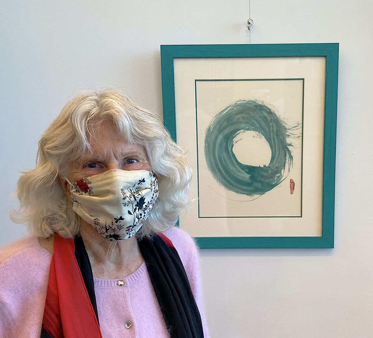 At the library, Rosemary KimBal posed with “Zen Wave,” the signature piece in her solo show.