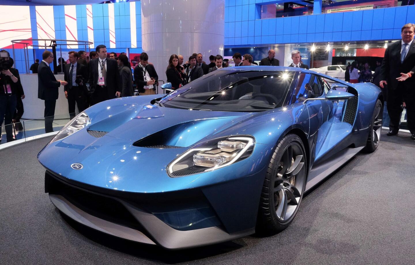 The new Ford GT is pictured at the Detroit Auto Show. Headed to production in 2016, the features a carbon fiber passenger cell and body panels, and a 3.5-liter twin-turbocharged V-6 engine that makes more than 600 horsepower.