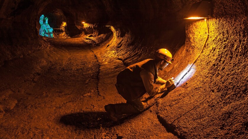 Electricians work on the lighting inside Nahuku-Thurston Lava Tube in the runup the reopening of the popular attraction on Hawaii Islands.