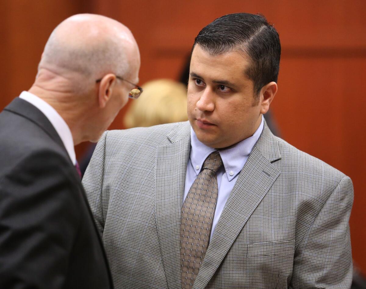 George Zimmerman talks to one of his lawyers in court in Sanford, Fla., on Wednesday. Jury selection will continue Thursday.
