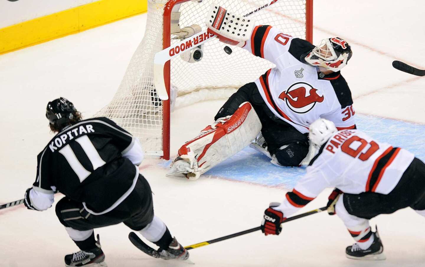 Kings forward Anze Kopitar, left, scores on New Jersey goalie Martin Brodeur during the second period in Game 3 of the Stanley Cup Final at Staples Center.