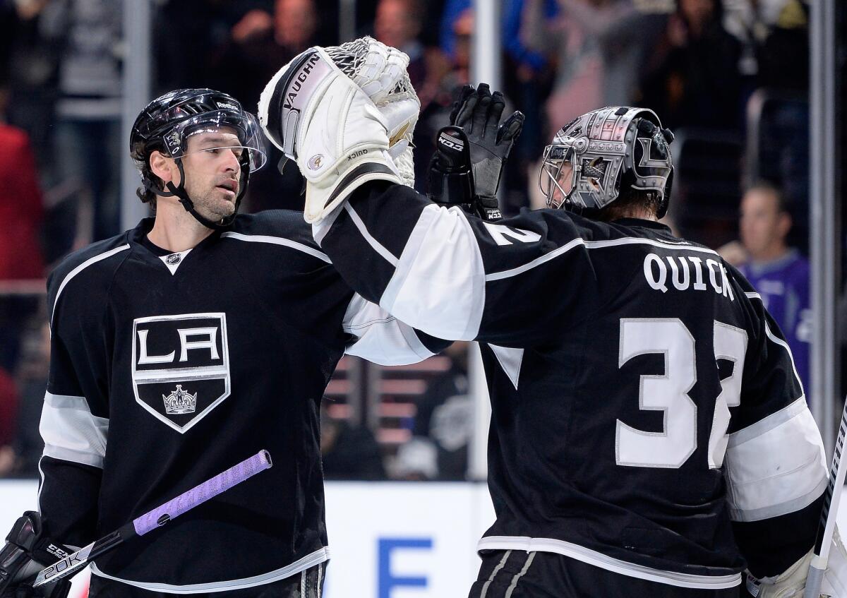 Kings forward Justin Williams and goalie Jonathan Quick celebrate after L.A.'s 2-0 win over the Boston Bruins on Dec. 2.