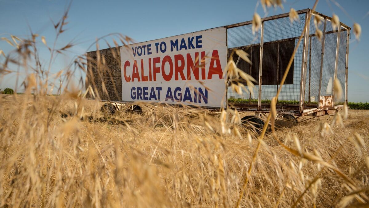 A sign on Highway 41 just south of Hanford, Calif., alludes to Donald Trump's presidential campaign slogan.