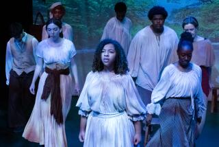 The cast of "By The River Rivanna," surround Cosette Okker (center) during the play performed on Tuesday Oct. 17th, 2023 in Santa Monica, Calif. at the Santa Monica Colllege Studio Stage. (Akemi Rico / The Corsair)