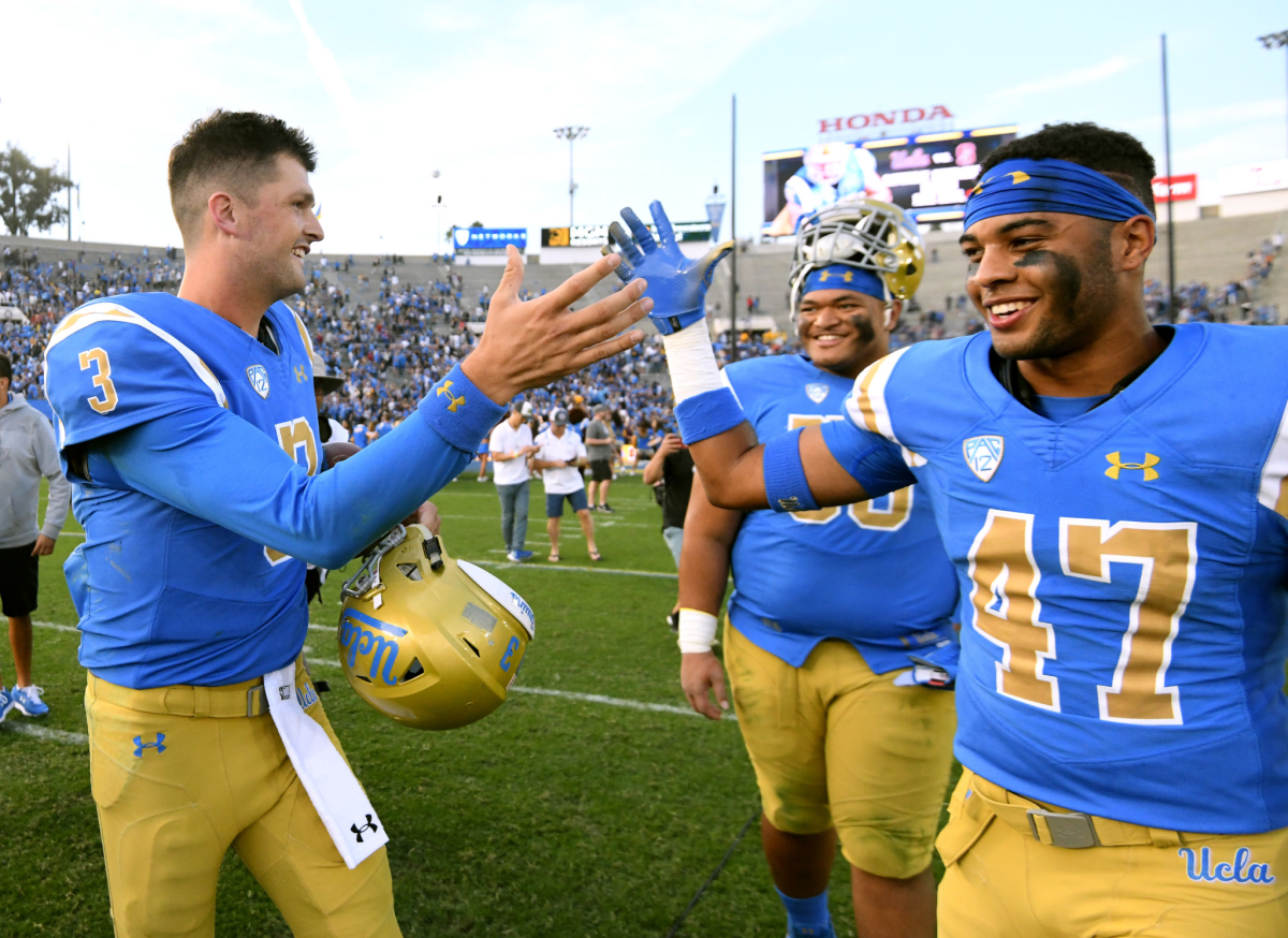 UCLA's Shea Pitts, right, celebrates with teammate Wilton Speight following a win over Cal in November 2018.