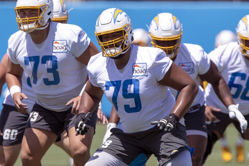 Los Angeles Chargers offensive tackle Trey Pipkins III (79) takes part in drills at the NFL.