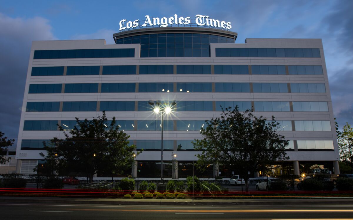 The Los Angeles Times logo atop a building.