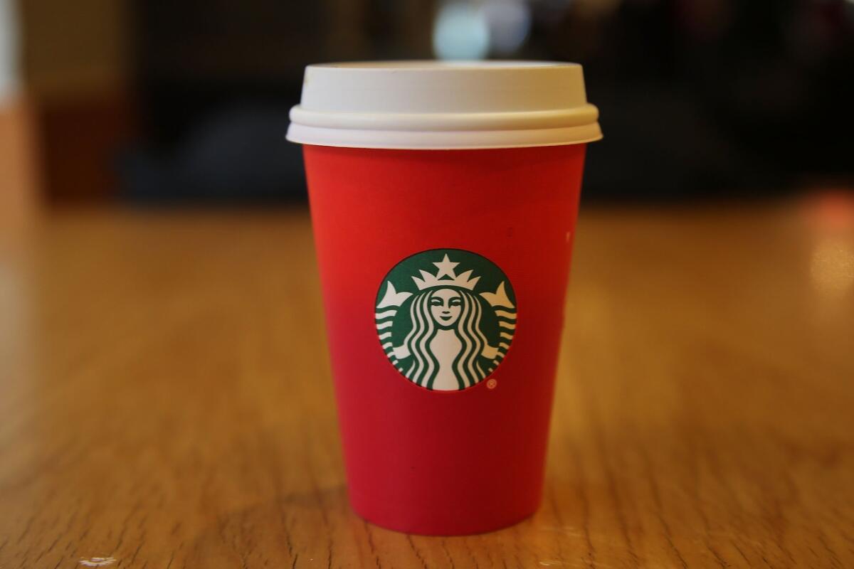 Starbucks' Christmas cup design — a red cup featuring the company's logo — has generated controversy as some have taken its simple look, sans Christmas iconography, as a "War on Christmas."