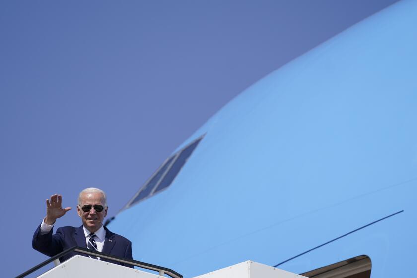 U.S. President Joe Biden waves before his departure to Saudi Arabia from Ben Gurion airport near Tel Aviv, Israel Friday, July 15, 2022. (AP Photo/Evan Vucci)