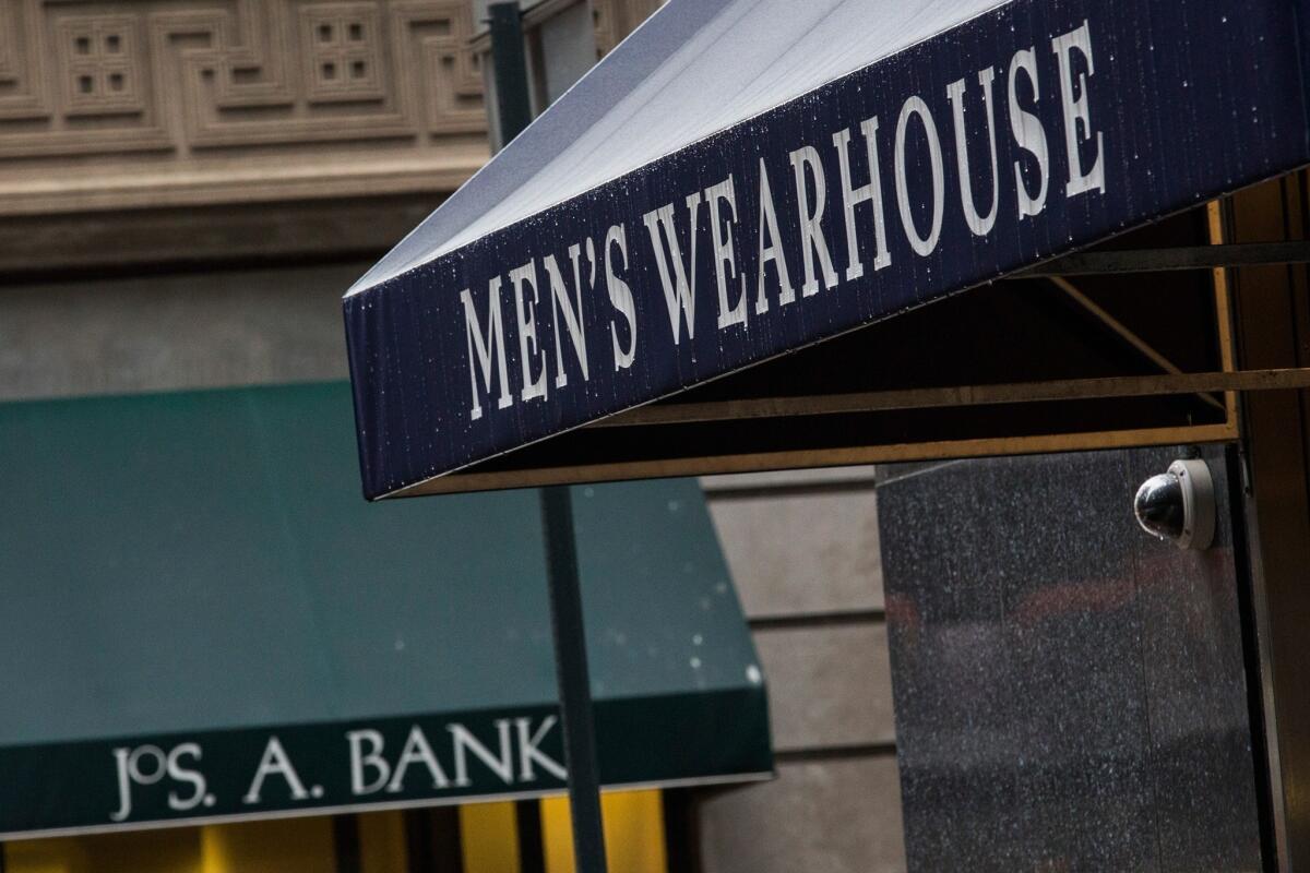 Men's Warehouse and Jos. A Bank storefronts stand near each other in New York City.