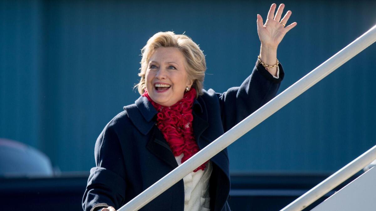 Democratic presidential candidate Hillary Clinton boards her campaign plane at Westchester County Airport in White Plains, N.Y., on Nov. 1.