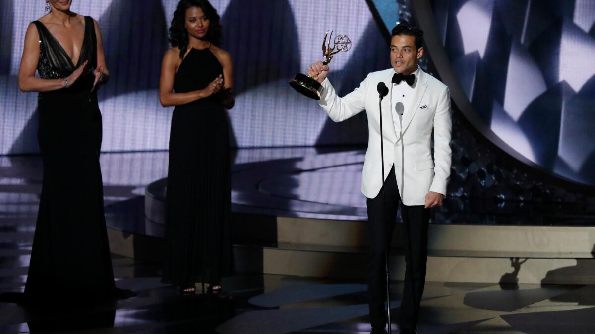 Rami Malek speaks as he accepts his Emmy for lead actor in a drama series.