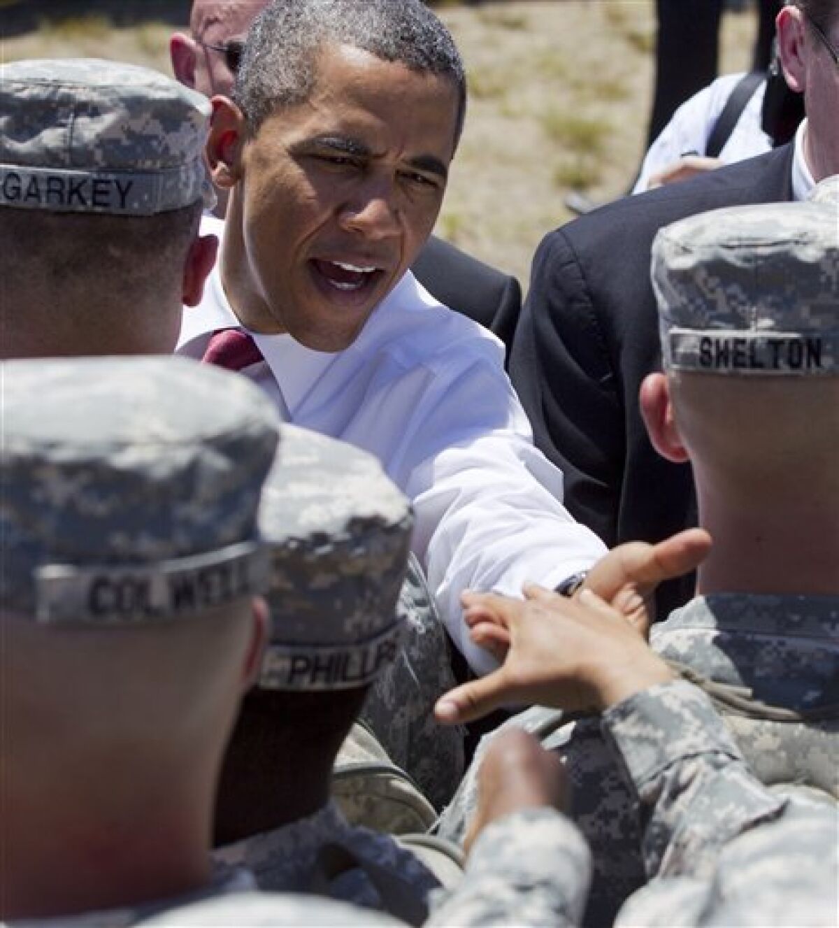 President Barack Obama reaches to shake hands with troops after speaking at the Third Infantry Division Headquarters, Friday, April 27, 2012, at Fort Stewart, Ga. (AP Photo/Carolyn Kaster)