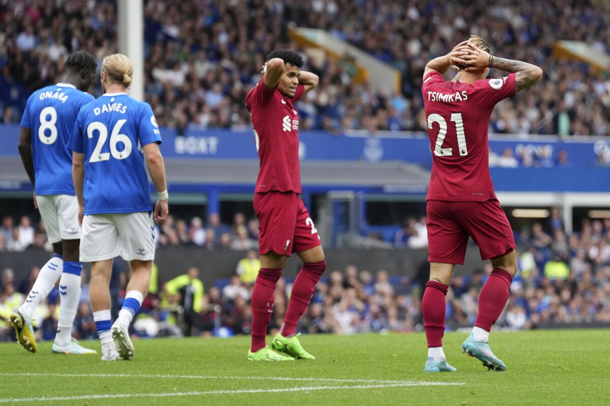 Liverpool's Kostas Tsimikas reacts after missing a scoring chance during the English Premier League soccer match between Everton and Liverpool at Goodison Park, Liverpool, England, Saturday, Sept. 3, 2022. (AP Photo/Jon Super)