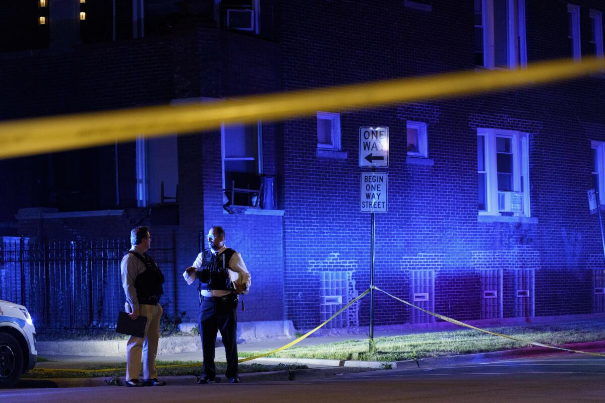 Police work the scene of a shooting in the East Garfield Park neighborhood on Tuesday June 15, 2021 in Chicago. Police say five people standing outside on Chicago’s West Side were shot in a violent end to a day that began with a fatal mass shooting on the city’s South Side (Armando L. Sanchez/Chicago Tribune via AP)