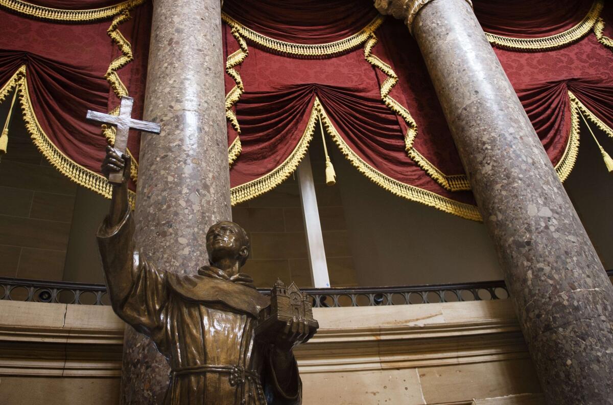 A statue of Father Junipero Serra, founder of California's missions and a controversial figure for his role in a process that began the decimation of the Native American population, stands in Statuary Hall in the U.S. Capitol in Washington.