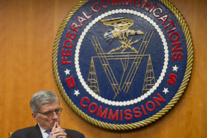 Federal Communications Commission Chairman Tom Wheeler listens to commissioners speak prior to a vote on net neutrality regulations in 2015.