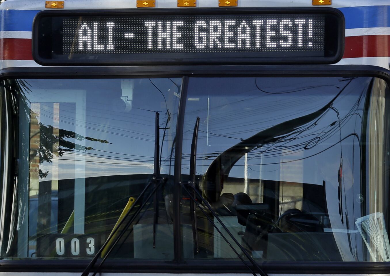 A Louisville bus carries a salute to native son Muhammad Ali.