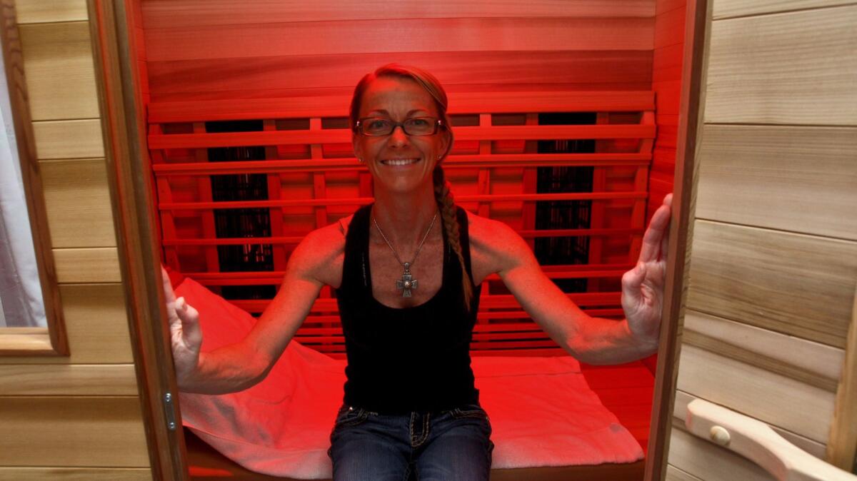 Burbank Infrared Sauna owner Jeannette Tashjian in one of her sauna units at her new business.