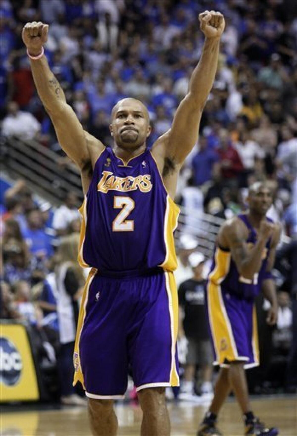 Los Angeles Lakers' Derek Fisher celebrates the Lakers' 99-91 overtime win over the Orlando Magic in Game 4 of the NBA basketball finals Friday, June 12, 2009, in Orlando, Fla. The Lakers take a 3-1 lead in the series. (AP Photo/David J. Phillip)