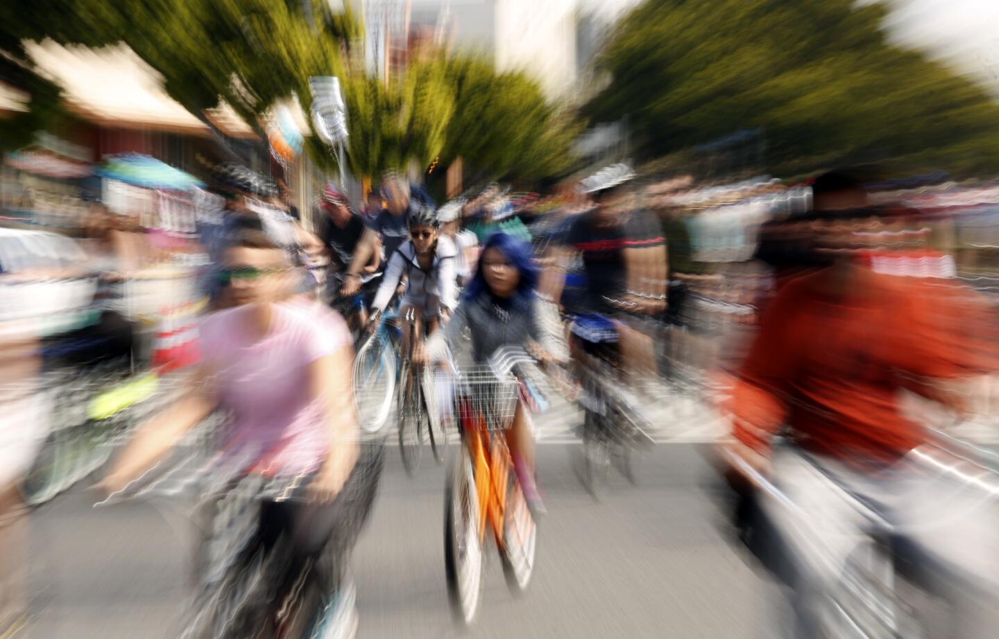 Thousands of cyclists, skaters and pedestrians make their way down Venice Boulevard while participating in CicLAvia in Mar Vista on Sunday morning.